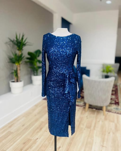Royal blue sequinned dress fitted on a dress form